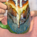 02-A New Earth Mug, 25 oz.
