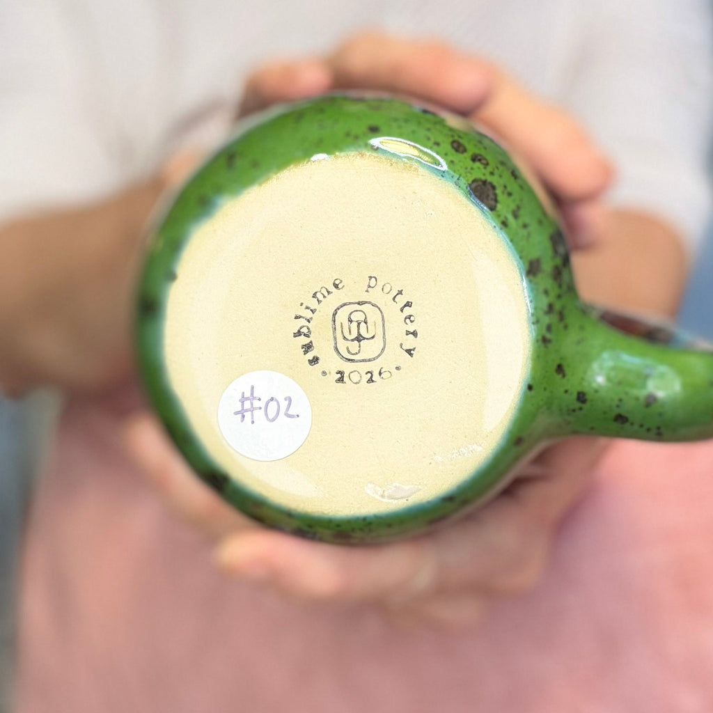 02-A New Earth Mug, 25 oz.